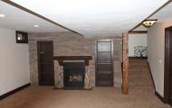 Basement Remodel with Fireplace and Stone Veneer